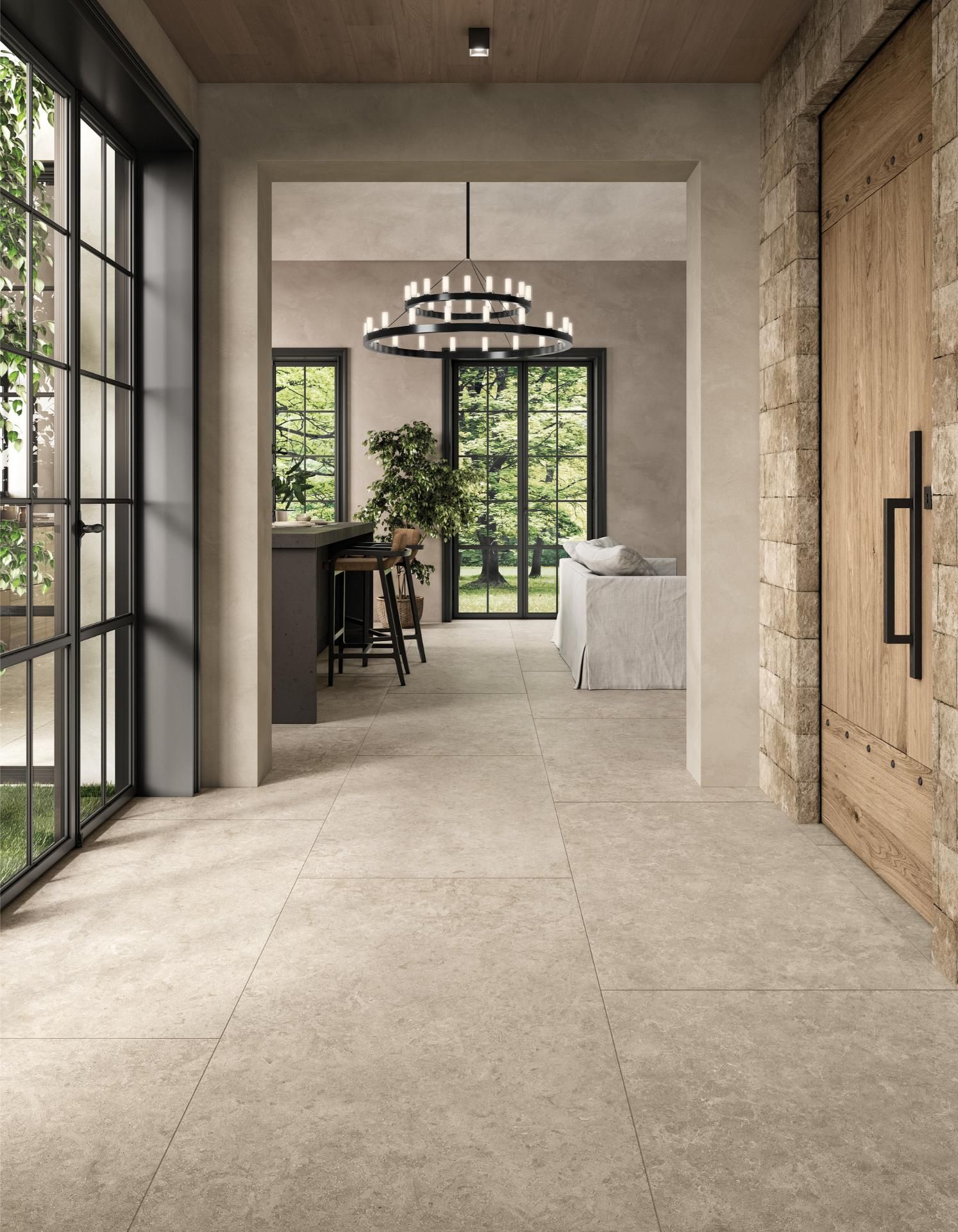 Moderne woonkamer met grote keramische vloertegels in natuursteenlook